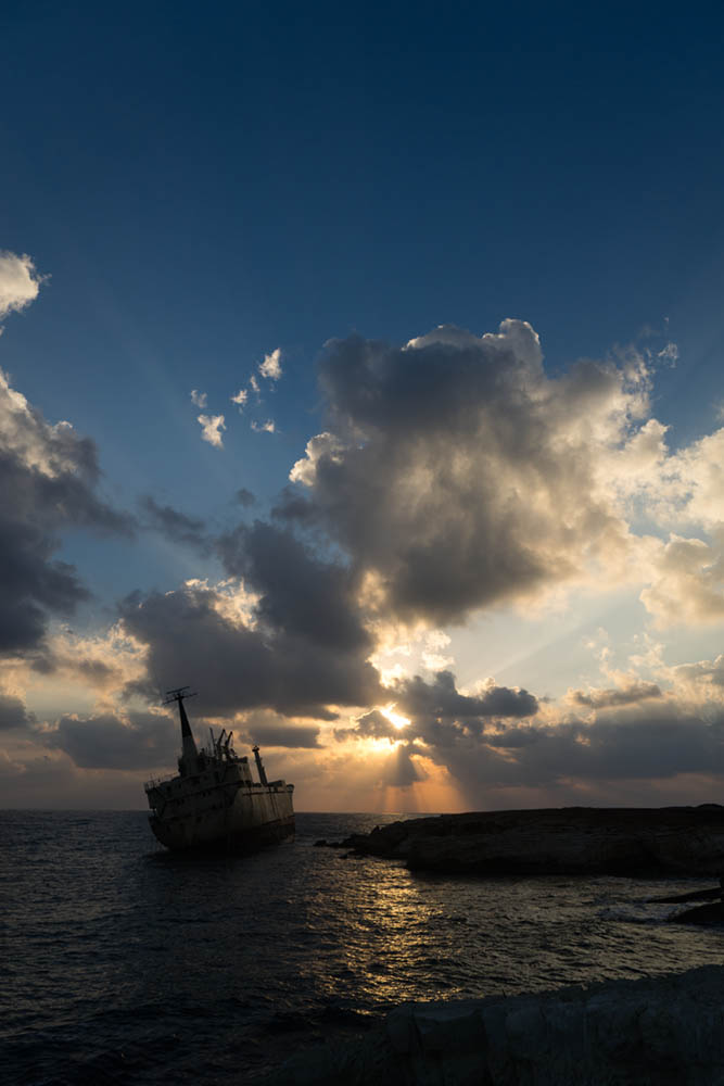 By using exposure compensation on the shipwreck in Cyprus we can make the sky more pleasing, but everything else is too dark, but we then use dodge and burn techniques to correct this. See image at end of post.